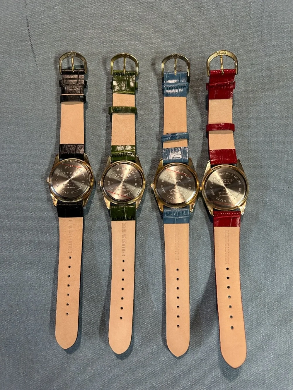 Four Gossip GSP471A vintage women's quartz wristwatches with a gold tone case.
